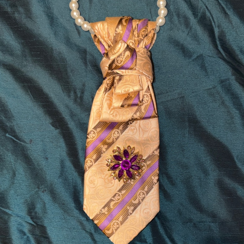 Gold and Purple Striped Necktie with Purple Brooch